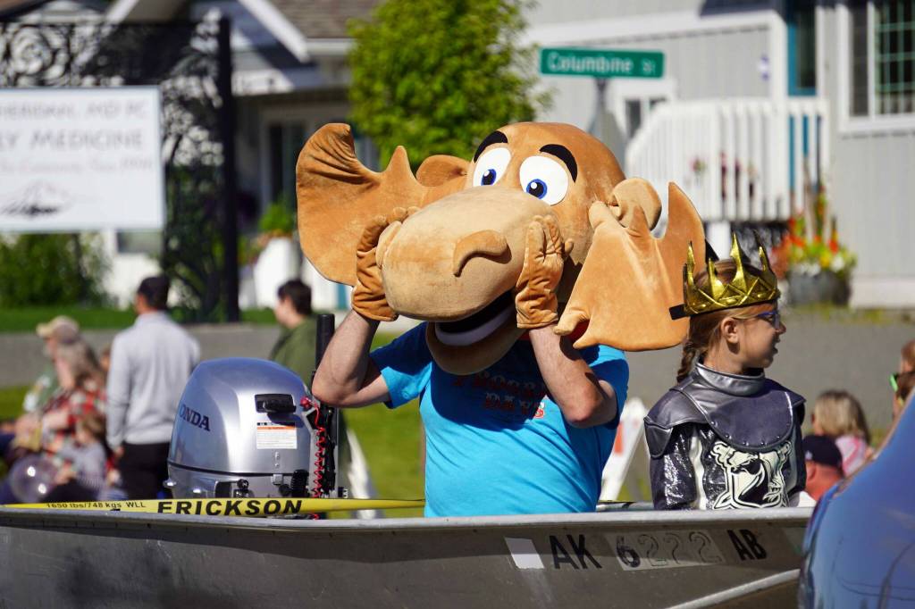 Nugget the Moose greets attendees while rolling with the 67th Annual Soldotna Progress Days Parade on Marydale Avenue in Soldotna, Alaska, on Saturday, July 27, 2024. (Jake Dye/Peninsula Clarion)