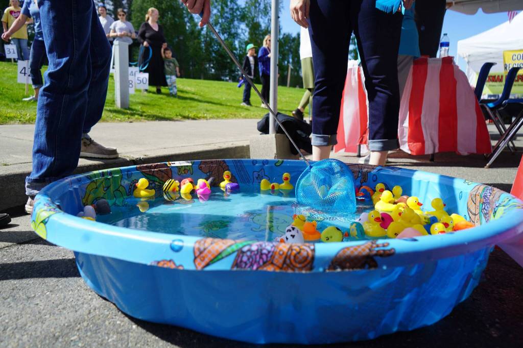 Children fish for ducks during the Progress Days Block Party at Parker Park in Soldotna, Alaska, on Saturday, July 27, 2024. (Jake Dye/Peninsula Clarion)
