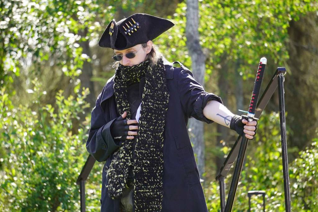 A cosplayer shows off their Bloodborne-inspired hunter costume during the Kenai Performers Cosplay Costume Contest at the Soldotna Progress Days Block Party in Parker Park in Soldotna, Alaska, on Saturday, July 27, 2024. (Jake Dye/Peninsula Clarion)