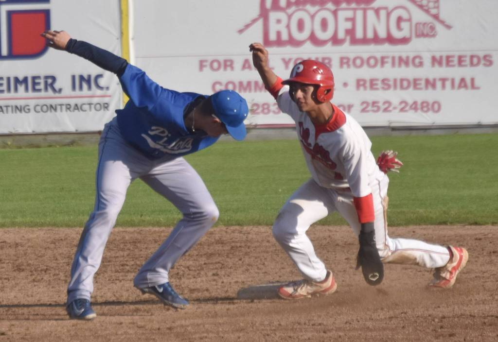 Oilers shortstop Petey Soto steals second in front of Anchorage Glacier Pilots shortstop Luke Heefner on Saturday, July 27, at Coral Seymour Memorial Park in Kenai, Alaska. (Photo by Jeff Helminiak/Peninsula Clarion)