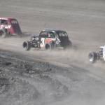 Josh Boone leads Owen Hart and Joey Essex on the way to victory in Heat 1 of the Legends on Saturday, July 27, 2024, at Twin City Raceway in Kenai, Alaska. (Photo by Jeff Helminiak/Peninsula Clarion)
