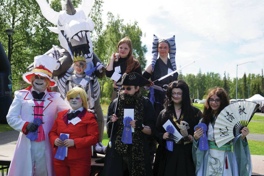 Jake Dye/Peninsula Clarion
Winners of the Kenai Performers Cosplay Costume Contest stand with their prizes at the Soldotna Progress Days Block Party in Parker Park in Soldotna on Saturday, July 27.