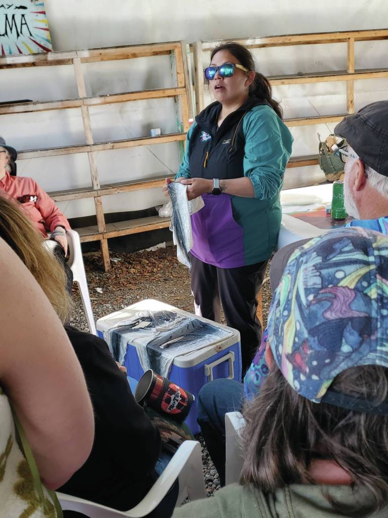 Yvonne Flynn hosts a fish skin tanning workshop in the Salmon Causeway at the Kenai Peninsula Fairgrounds during Salmonfest on Sunday, Aug. 4, 2024, in Ninilchik, Alaska. (Delcenia Cosman/Homer News)