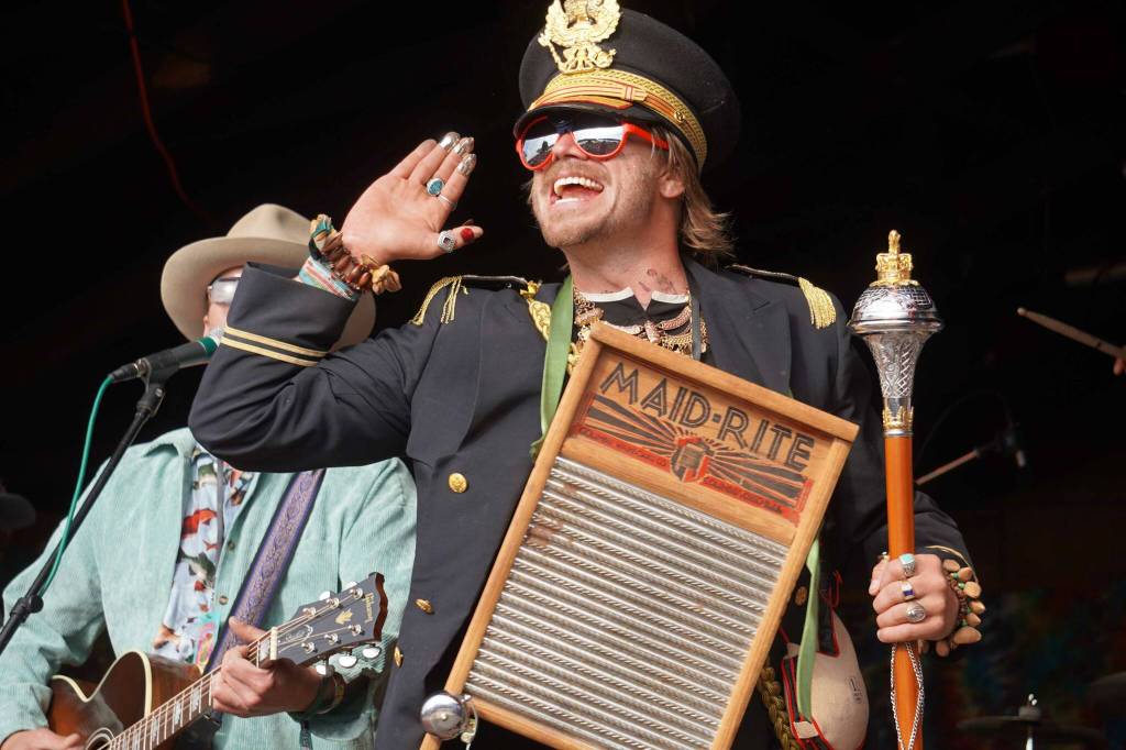Members of the Salmonfest Marching Band join the Roland Roberts Band onstage at Salmonfest in Ninilchik, Alaska, on Saturday, Aug. 3, 2024. (Jake Dye/Peninsula Clarion)