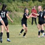 Kenai Kicks Avi Bloom, second from left, celebrates her goal with, from left to right, Lily Hough, Morgan Buckbee and Morgan Berger on Saturday, Aug. 3, 2024, at the Kenai Sports Complex in Kenai, Alaska, in a U13 Alaska Youth State Cup game against Cook Inlet Soccer Club. (Photo by Jeff Helminiak/Peninsula Clarion)