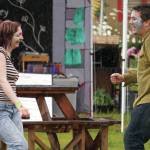 Attendees dance in the rain at the Kenai Peninsula Fair in Ninilchik, Alaska, on Friday, Aug. 11, 2023. (Jake Dye/Peninsula Clarion)