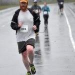 Ryan Peterson leads a pack of runners at the 35th Violence Free Community Run on Saturday, Aug. 10, 2024, in Kenai, Alaska. (Photo by Jeff Helminiak/Peninsula Clarion)