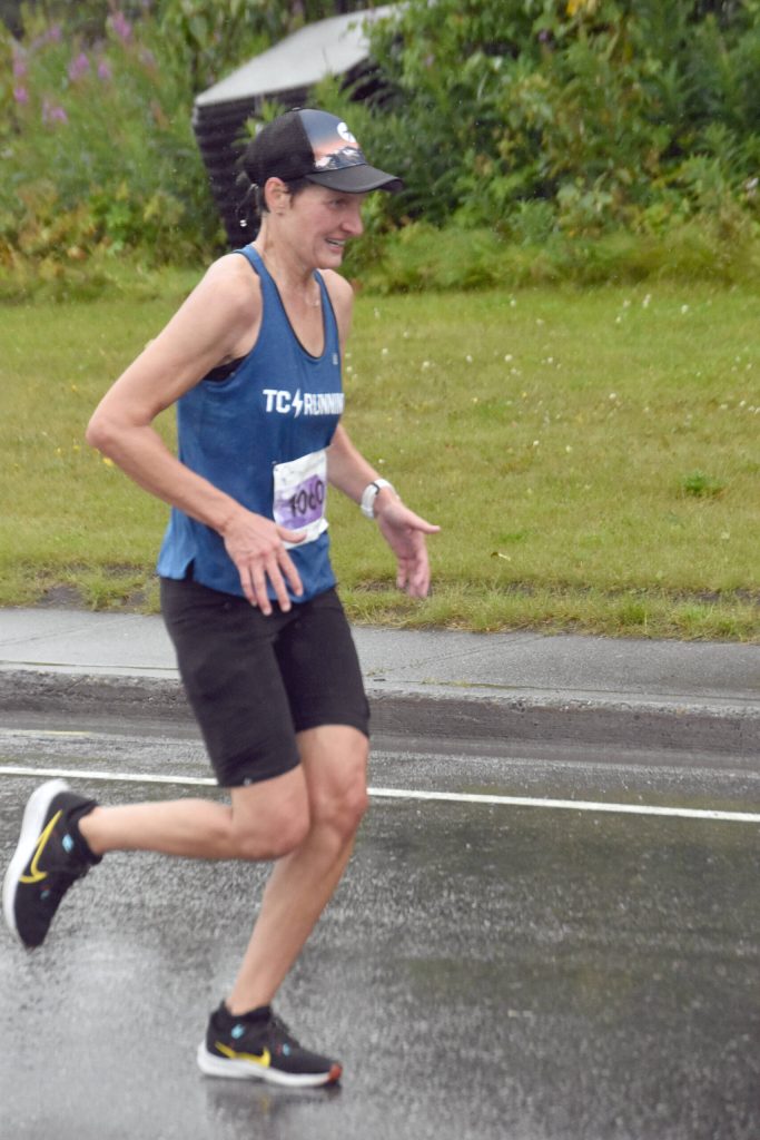 Angie Voight runs to victory in the 35th Violence Free Community Run on Saturday, Aug. 10, 2024, in Kenai, Alaska. (Photo by Jeff Helminiak/Peninsula Clarion)