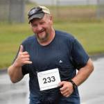 Kurt Shnowske runs in the 35th Violence Free Community Run on Saturday, Aug. 10, 2024, in Kenai, Alaska. (Photo by Jeff Helminiak/Peninsula Clarion)