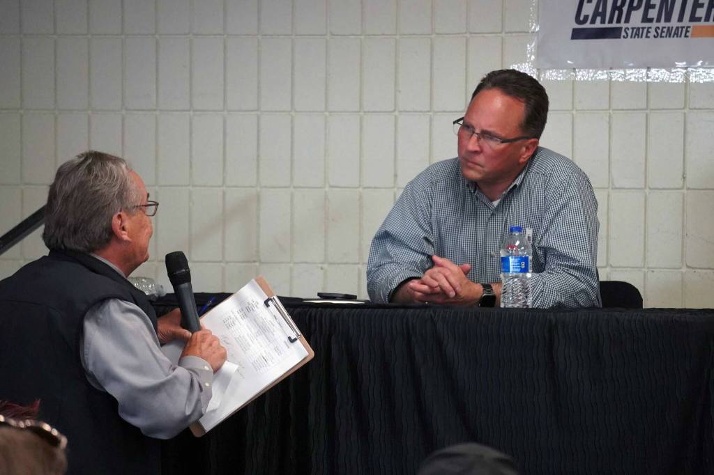 Moderator Merrill Sikorski asks a question of Rep. Ben Carpenter, R-Nikiski, during a debate with Sen. Jesse Bjorkman organized by the District 8 Alaska Republican Party at the Soldotna Regional Sports Complex in Soldotna, Alaska, on Monday, Aug. 12, 2024. (Jake Dye/Peninsula Clarion)