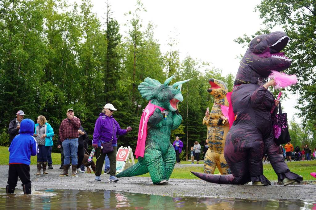 Racers near the Kenai Lions Refueling Station during the Brewery to Bathroom .5K The Race for the Rest of Us at Kenai River Brewing in Soldotna, Alaska, on Saturday, Aug. 11, 2024. (Jake Dye/Peninsula Clarion)