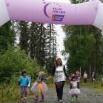 Racers celebrate completing the Brewery to Bathroom .5K The Race for the Rest of Us at Kenai River Brewing in Soldotna, Alaska, on Saturday, Aug. 11, 2024. (Jake Dye/Peninsula Clarion)