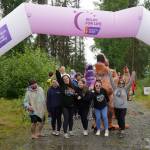 Racers celebrate completing the Brewery to Bathroom .5K The Race for the Rest of Us at Kenai River Brewing in Soldotna, Alaska, on Saturday, Aug. 11, 2024. (Jake Dye/Peninsula Clarion)