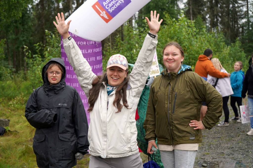 Racers celebrate completing the Brewery to Bathroom .5K The Race for the Rest of Us at Kenai River Brewing in Soldotna, Alaska, on Saturday, Aug. 11, 2024. (Jake Dye/Peninsula Clarion)