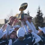 Soldotna hoists the First National Bowl on Saturday, Oct. 21, 2023, after the Division II championship game at Service High School in Anchorage, Alaska. (Photo by Jeff Helminiak/Peninsula Clarion)