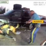 Troopers Joseph Miller Jr. and Jason Woodruff are seen as K9 Olex bites Ben Tikka in a screenshot from body camera footage taken in Kenai, Alaska, on May 24, 2024. (Photo provided by Alaska Department of Law)