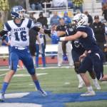 Palmer quarterback Nolan Garner passes under pressure from Soldotna linebacker Trevor Michael on Friday, Aug. 16, 2024, at Justin Maile Field at Soldotna High School in Soldotna, Alaska. (Photo by Jeff Helminiak/Peninsula Clarion)