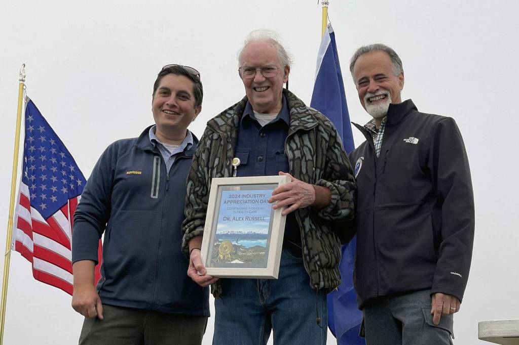 Dr. Alex Russell receives the Outstanding Individual in Health Care award at Industry Appreciation Day in Kenai, Alaska, on Saturday, Aug. 17, 2024. (Jake Dye/Peninsula Clarion)