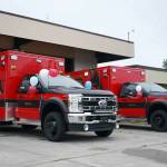 A pair of new ambulances are seen ahead of their dedication ceremony at the Kenai Public Safety Building in Kenai, Alaska, on Saturday, Aug. 17, 2024. (Jake Dye/Peninsula Clarion)