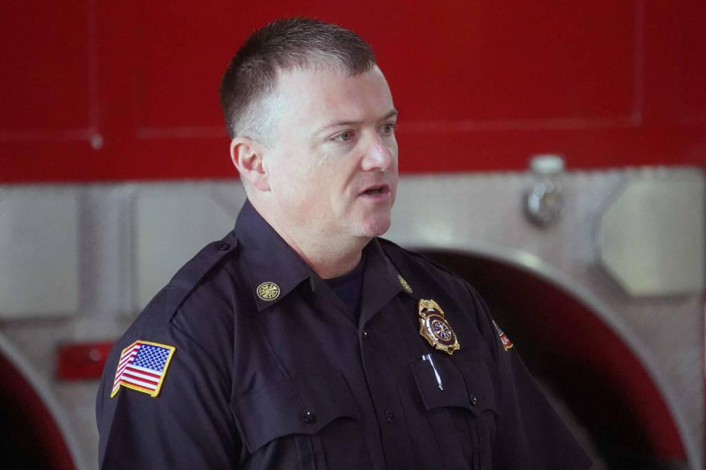 Kenai Fire Department Chief Jay Teague speaks at a dedication ceremony for a pair of new ambulances at the Kenai Public Safety Building in Kenai, Alaska, on Saturday, Aug. 17, 2024. (Jake Dye/Peninsula Clarion)