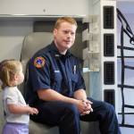 Kenai Fire Department staff give tours of a pair of new ambulances at the Kenai Public Safety Building in Kenai, Alaska, on Saturday, Aug. 17, 2024. (Jake Dye/Peninsula Clarion)