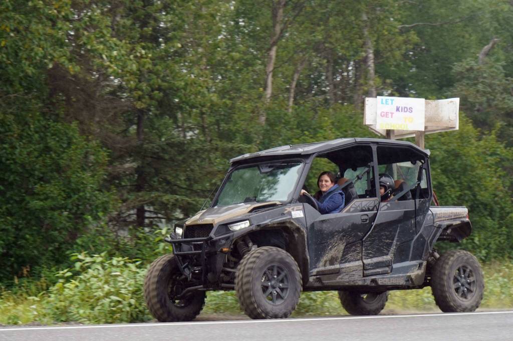 Misty Peterkin leads the Community Ride for Parking Policy Change along Nikishka Beach Road in Nikiski, Alaska, on Saturday, Aug. 17, 2024. (Jake Dye/Peninsula Clarion)