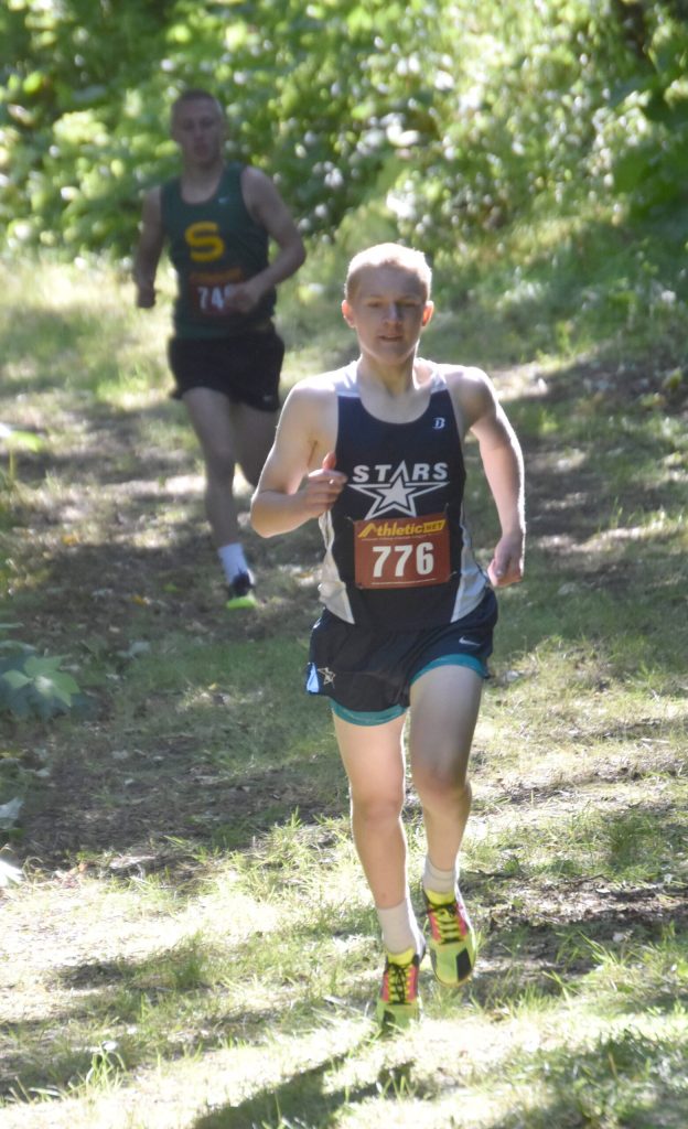 Soldotnas Ollie Dahl leads Sewards Ridge Conant at the start of the freshmen-sophomore boys race Monday, Aug. 19, 2024, at the Peninsula Class Races at Nikiski Middle-High School in Nikiski, Alaska. (Photo by Jeff Helminiak/Peninsula Clarion)