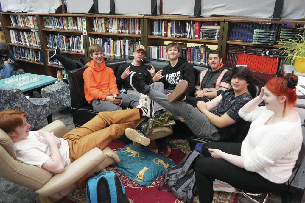 Jake Dye/Peninsula Clarion
Students sit together during a break period on the first day of the school year at River City Academy near Soldotna on Wednesday.