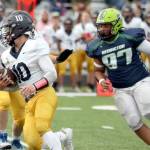 Homer's Preston Stanislaw carries the ball against Redington on Friday, Aug. 23, 2024, in Wasilla, Alaska. (Photo courtesy of Bruce Eggleston/matsusports.net)