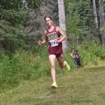 Grace Christians Robbie Annett leads the boys varsity race at the Ted McKenney XC Invitational on Saturday, Aug. 24, 2024, at Tsalteshi Trails just outside of Soldotna, Alaska. (Photo by Jeff Helminiak/Peninsula Clarion)