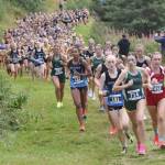 Services Talia Smith leads the girls varsity race up Angle Hill during the Ted McKenney XC Invitational on Saturday, Aug. 24, 2024, at Tsalteshi Trails just outside of Soldotna, Alaska. (Photo by Jeff Helminiak/Peninsula Clarion)