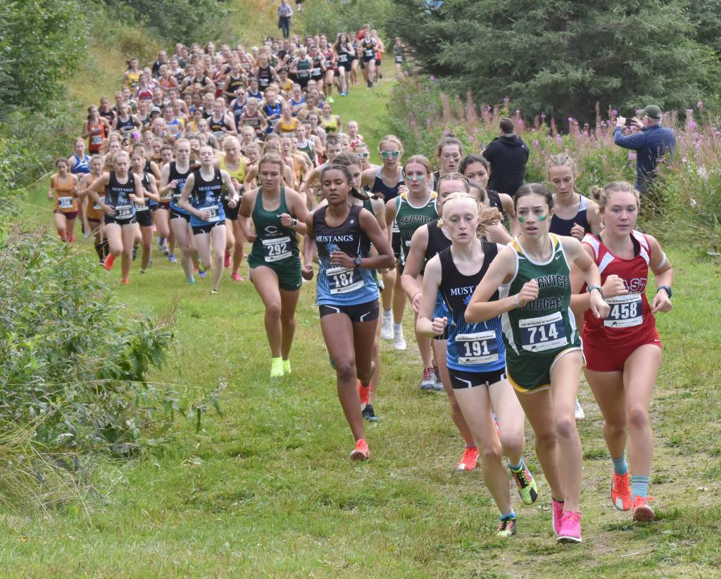 Services Talia Smith leads the girls varsity race up Angle Hill during the Ted McKenney XC Invitational on Saturday, Aug. 24, 2024, at Tsalteshi Trails just outside of Soldotna, Alaska. (Photo by Jeff Helminiak/Peninsula Clarion)
