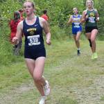 Homers Claira Booz leads Sewards Katie Van Buskirk in the girls varsity race at the Ted McKenney XC Invitational on Saturday, Aug. 24, 2024, at Tsalteshi Trails just outside of Soldotna, Alaska. (Photo by Jeff Helminiak/Peninsula Clarion)