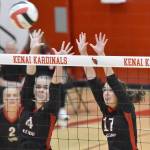 Avia Miller and Sarah Baisden go up for a block against Kodiak at Kenai Central High School in Kenai, Alaska, on Thursday, Aug. 29, 2024. (Photo by Jeff Helminiak/Peninsula Clarion)