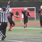 Kenai Central's Zane James celebrates his touchdown catch Friday, Aug. 30, 2024, at Ed Hollier Field at Kenai Central HIgh School in Kenai, Alaska. (Photo by Jeff Helminiak/Peninsula Clarion)