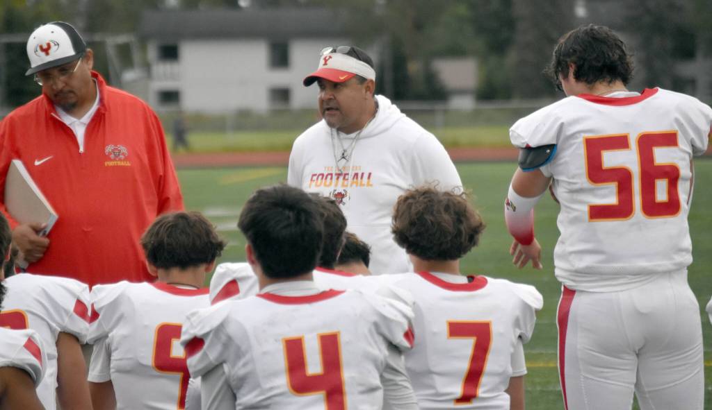 Head coach John Marquez of Yreka (California) addresses his team at halftime Friday, Aug. 30, 2024, at Ed Hollier Field at Kenai Central HIgh School in Kenai, Alaska. (Photo by Jeff Helminiak/Peninsula Clarion)