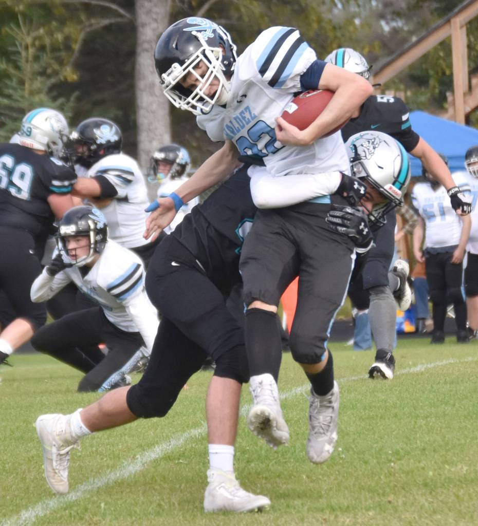 Nikiskis Trigger McCaughey tackles Valdezs Dylan Passage on Saturday, Aug. 31, 2024, at Nikiski Middle-High School in Nikiski, Alaska. (Photo by Jeff Helminiak/Peninsula Clarion)
