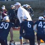 Soldotna head coach Galen Brantley Jr. congratulates his team on Saturday, Oct. 21, 2023, after the Division II championship game at Service High School in Anchorage, Alaska. (File photo by Jeff Helminiak/Peninsula Clarion)