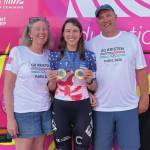 From left: Sara, Kristen and Jon Faulkner pose with Kristen's two gold medals at the 2024 Olympics in Paris, France. (Photo provided by Jon Faulkner)