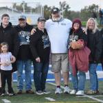Soldotna head coach Galen Brantley Jr. and family members celebrate Brantley Jr. amassing the most wins in Alaska history Friday, Sept. 6, 2024, at Justin Maile Field at Soldotna High School in Soldotna, Alaska. (Photo by Jeff Helminiak/Peninsula Clarion)