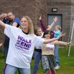 Diamond Dance Project performs alongside people pulled from their audience ahead of the start of the Second Annual Kenai Peninsula Walk to End Alzheimers at the Challenger Learning Center of Alaska in Kenai, Alaska, on Saturday, Sept. 7, 2024. (Jake Dye/Peninsula Clarion)
