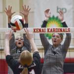 Nikiskis Mandee Roofe and Ashlynne Playle put up a block on Kenai Centrals Ellsi Miller on Tuesday, Sept. 10, 2024, at Kenai Central High School in Kenai, Alaska. (Photo by Jeff Helminiak/Peninsula Clarion)