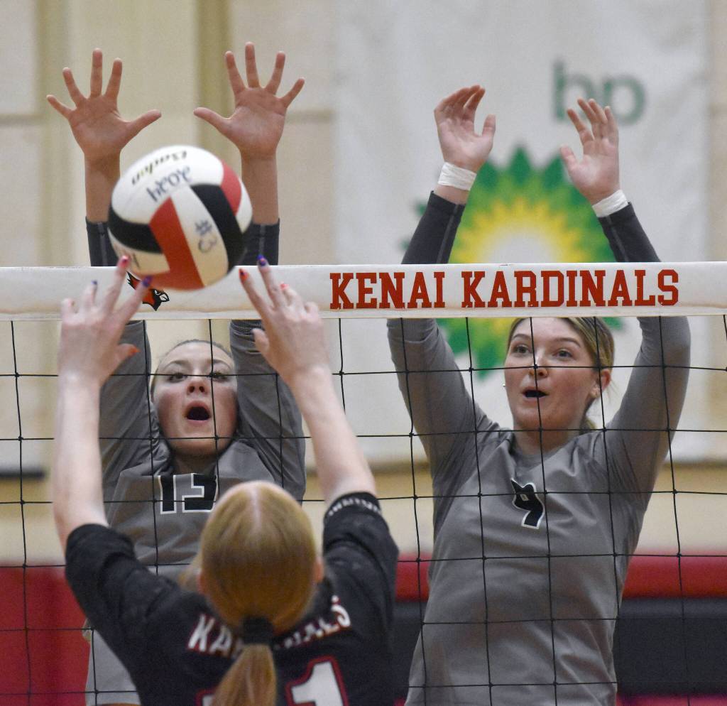 Nikiskis Mandee Roofe and Ashlynne Playle put up a block on Kenai Centrals Ellsi Miller on Tuesday, Sept. 10, 2024, at Kenai Central High School in Kenai, Alaska. (Photo by Jeff Helminiak/Peninsula Clarion)