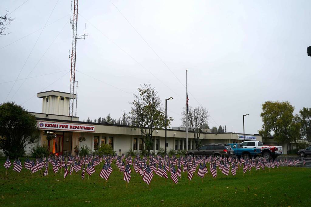 Flags placed in honor of the emergency services personnel who lost their lives in the Sept. 11, 2001, attacks fill the lawn in front of Kenai Fire Department during a commemoration ceremony in Kenai, Alaska, on Wednesday, Sept. 11, 2024. (Jake Dye/Peninsula Clarion)