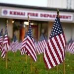 Flags placed in honor of the emergency services personnel who lost their lives in the Sept. 11, 2001, attacks fill the lawn in front of Kenai Fire Department during a commemoration ceremony in Kenai, Alaska, on Wednesday, Sept. 11, 2024. (Jake Dye/Peninsula Clarion)
