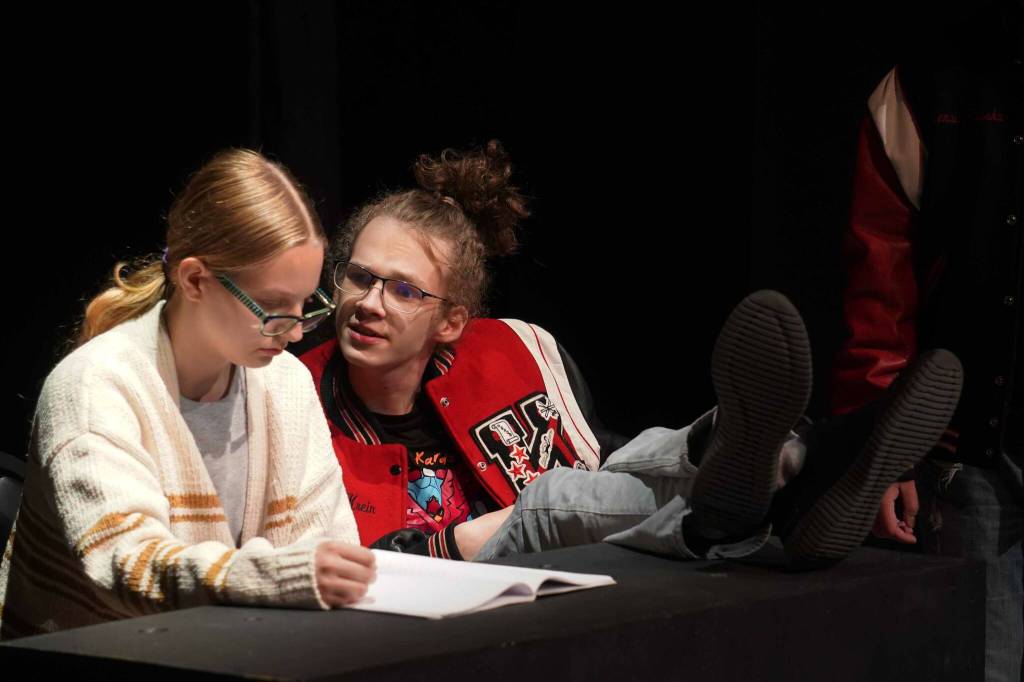 Arwen Waarvik and Gavin Hunt, part of the Kenai Performers cast of The Bullying Collection, rehearse at the Kenai Performers Theater in Kalifornsky, Alaska, on Monday, Sept. 9, 2024. (Jake Dye/Peninsula Clarion)