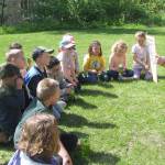 Rowan Yorkston explains the importance of the different habitats on the Kenai Peninsula to Critter Camp campers. (Photo provided by refuge)