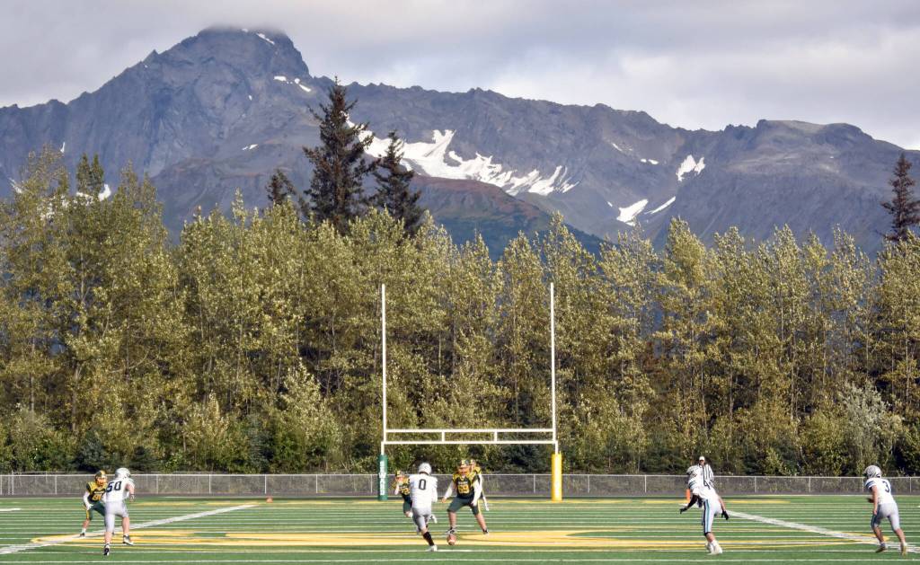 Nikiskis Oliver Parrish puts the ball in play for the first time on the new artificial turf Friday, Sept. 13, 2024, at Roger Steinbrecher Memorial Field in Seward, Alaska. (Photo by Jeff Helminiak/Peninsula Clarion)