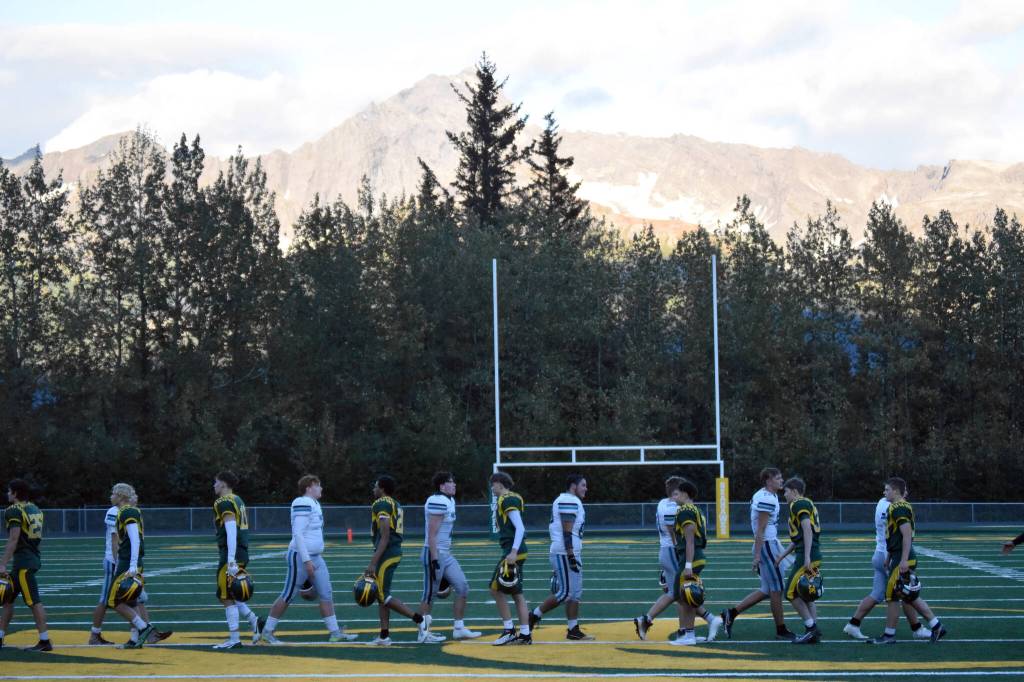 Seward and Nikiski shake hands after the first football game on the artificial turf Friday, Sept. 13, 2024, at Roger Steinbrecher Memorial Field in Seward, Alaska. (Photo by Jeff Helminiak/Peninsula Clarion)