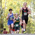 Kenai Centrals Chase Laker clears an incline during the boys varsity race of the Wasilla Trailblazer Invite on Friday, Sept. 13, in Wasilla, Alaska. (Photo by Jeremiah Bartz/Frontiersman)